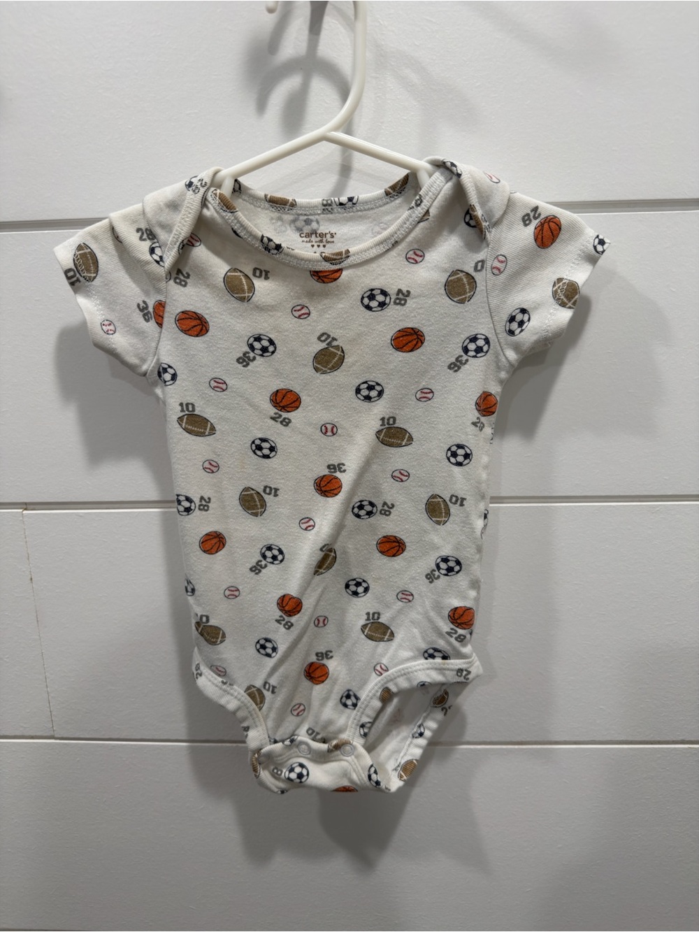 Carter's White One-Piece with Orange and Brown Sports Print